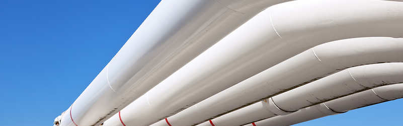 Pipelines against blue sky