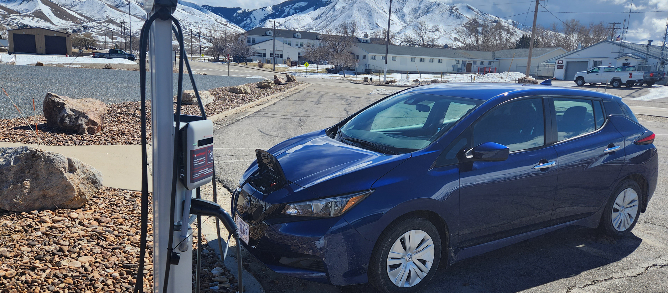 An electric vehicle parked at a charging station.